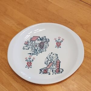 Vintage White Ceramic Plate with Rustic Design